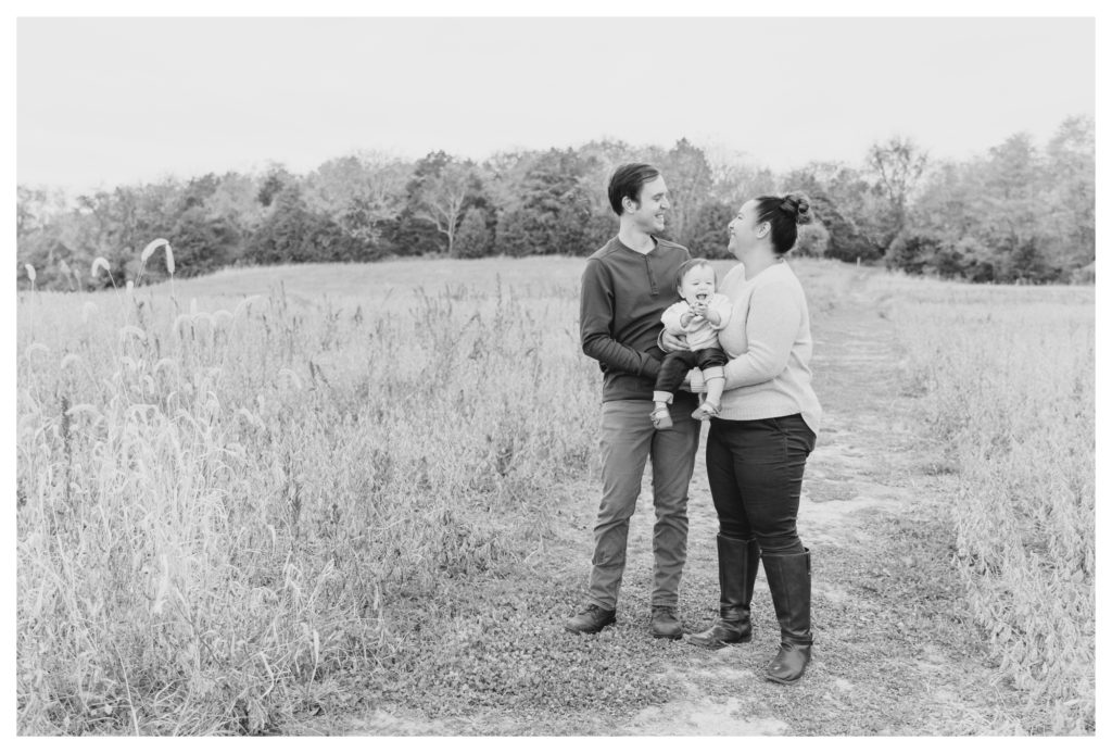 Fall Family Photos Antietam Maryland - black and white photo of couple and baby girl in a field