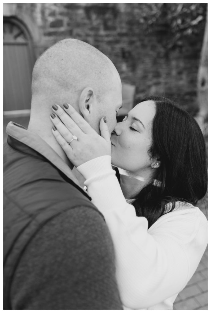 Winter Engagement Photos Alexandria VA Waterfront - black and white photo of couple kissing
