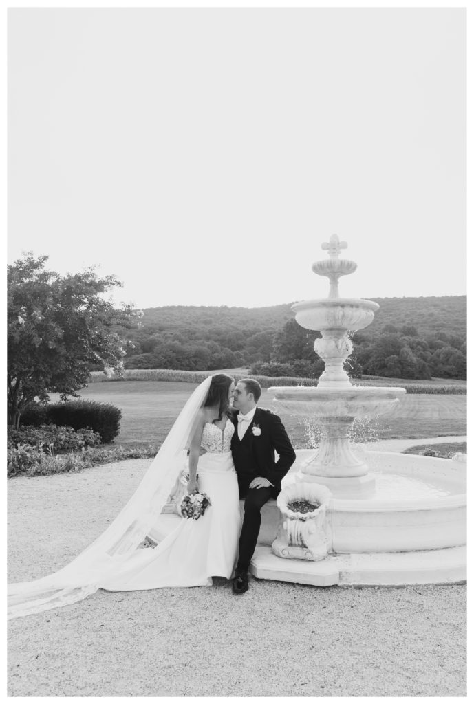 Elegant Springfield Manor Wedding Photography - bride and groom black and white portrait with fountain